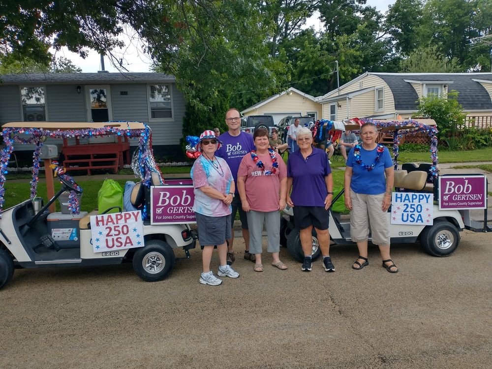 Bob Gertsen and supporters at a parade with a decorated cart