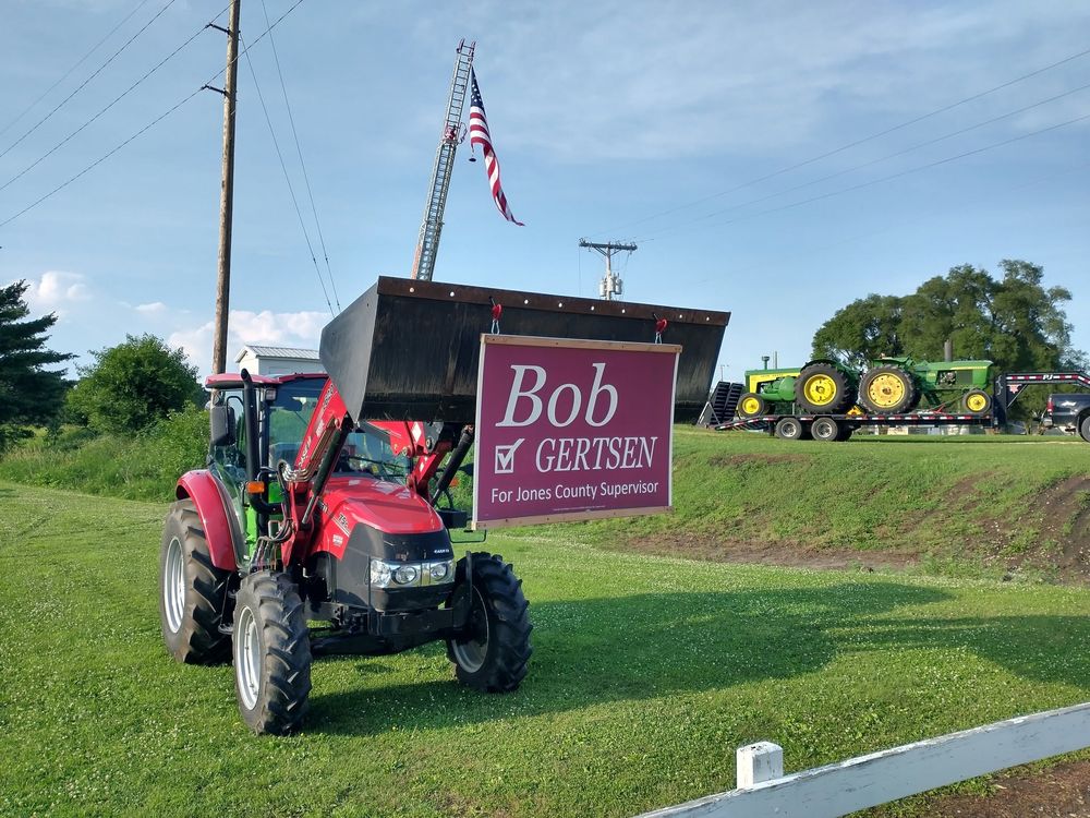 A Bob Gertsen campaign sign in front of farm equipment